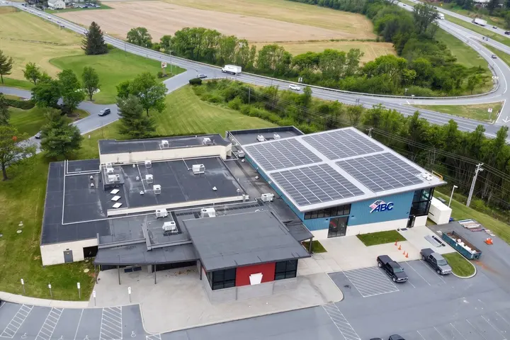 The Associated Builders and Contractors building in Manheim, PA, seen from above, with solar panels on one roof