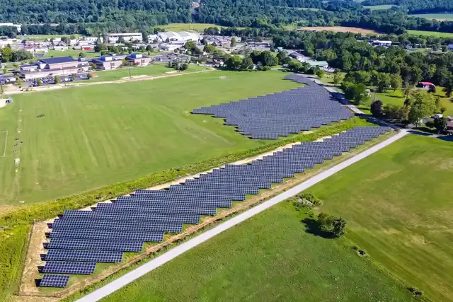 Midd-West School District's ground-mounted solar arrays beside its playing fields in Middleburg, from a drone