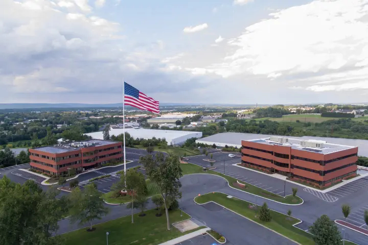 4550 and 4530 Lena Drive in Mechanicsburg, PA, seen from above, with solar panels on the roofs of both buildings