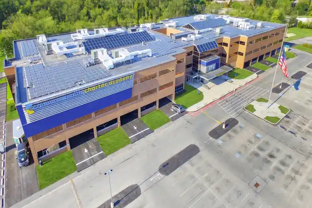 Solar panels across the rooftops of Commonwealth Charter Academy in Harrisburg, from a drone