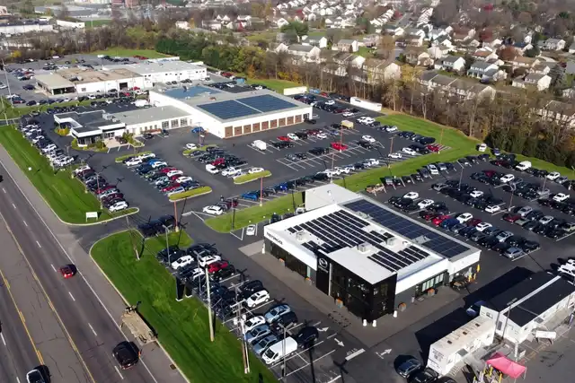 Rooftop solar arrays on Freysinger GMC & Hyundai's dealership buildings in Mechanicsburg, from a drone