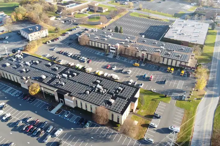 Rows of solar panels across the roofs of Vartan Group's two buildings on Vartan Way in Harrisburg, PA, seen from above
